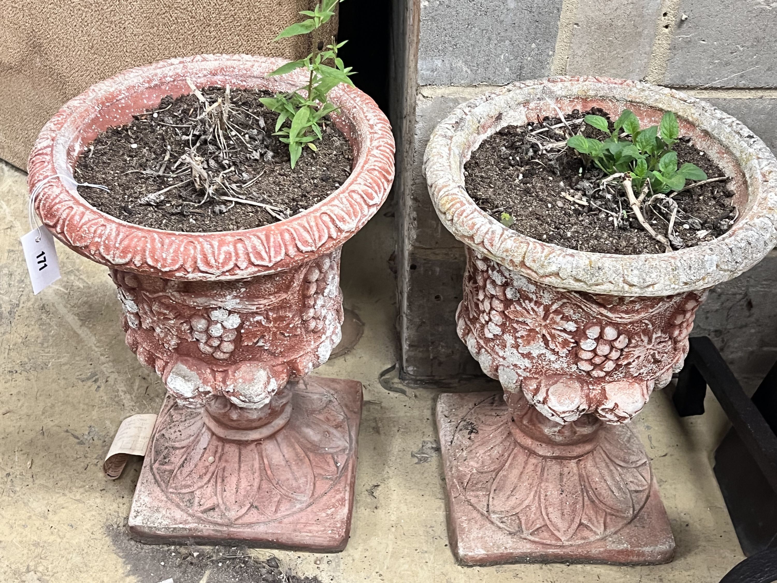 A pair of painted reconstituted stone campana garden urns, diameter 36cm height 49cm